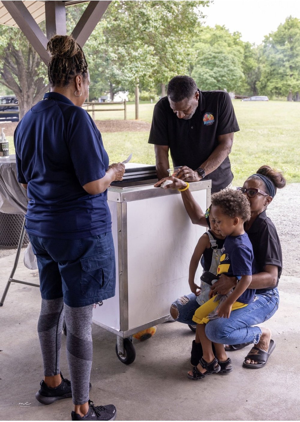 A family enjoying Italian ice at the IcyScott cart
