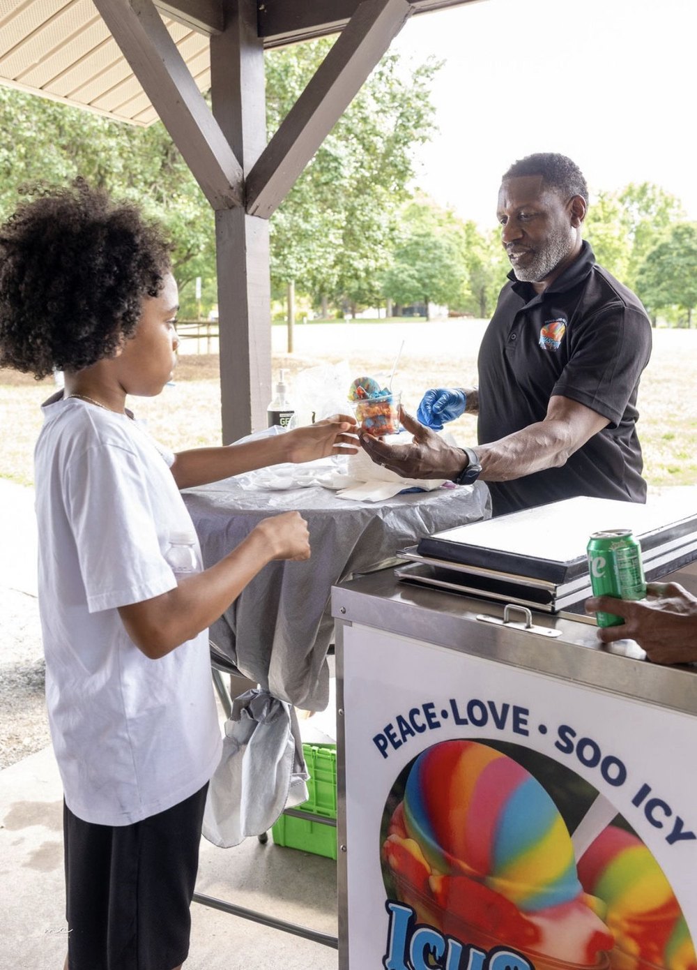 Serving a young customer at a Charlotte park